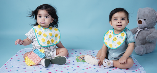 Comparing Silicone vs. Fabric Bibs: Which is Better for Your Baby?
