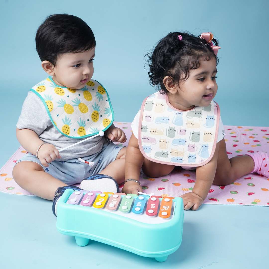 Two-babies-playing-on-a-baby-playmat