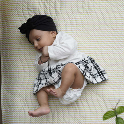 Baby-laying-on-playmat