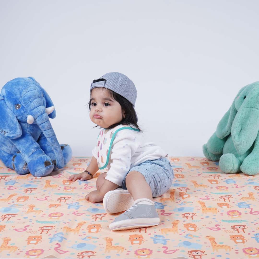 baby-sitting-on-crib-sheet