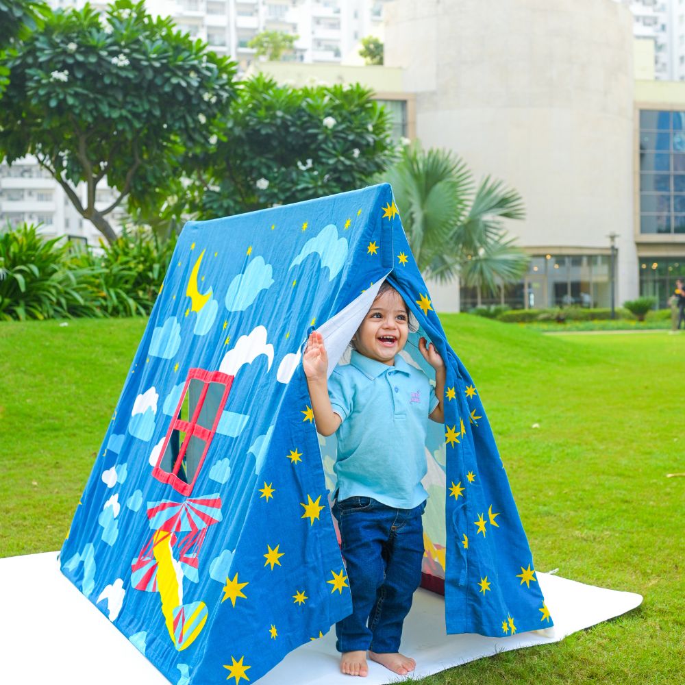 Baby Playing with midnight play tent
