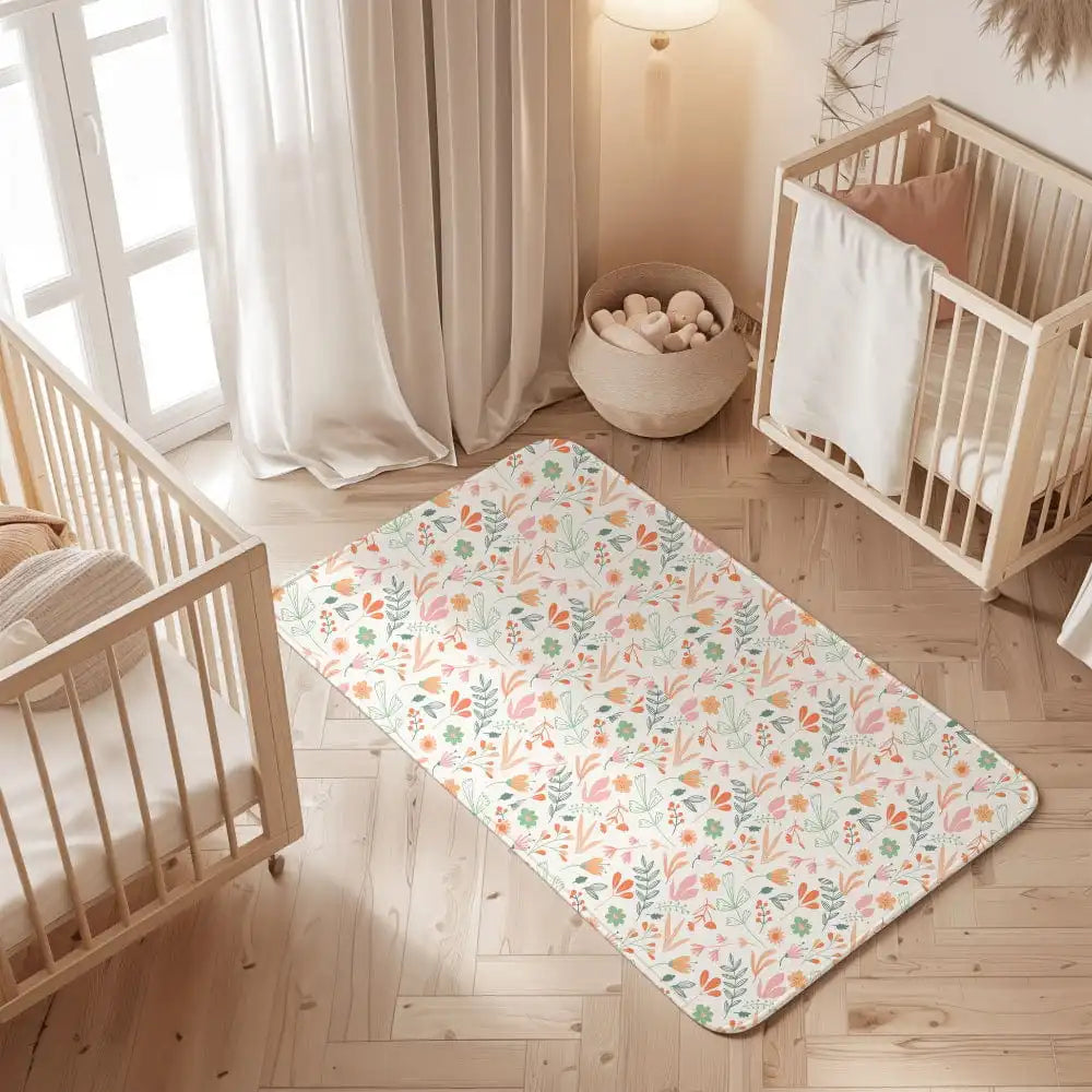 Leaves print waterproof baby dry sheet laid flat on a bed