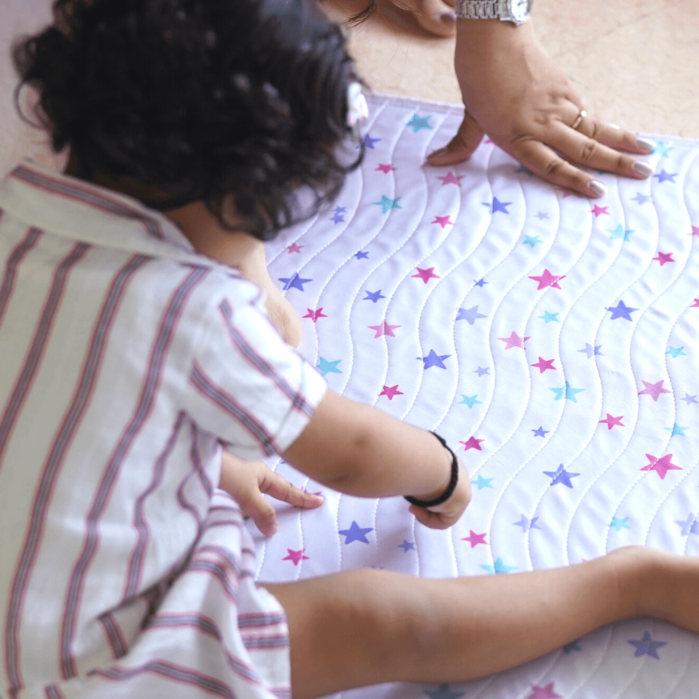 Baby Playing On Star Print Mat