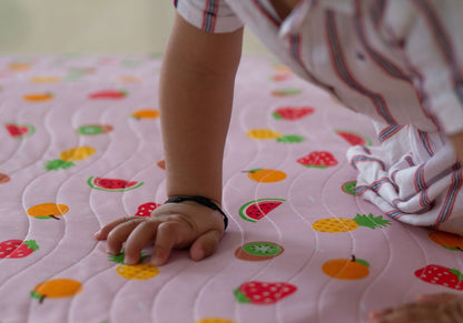 Baby-on-playmat
