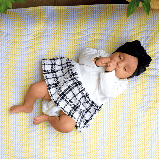 Baby-laying-on-playmat